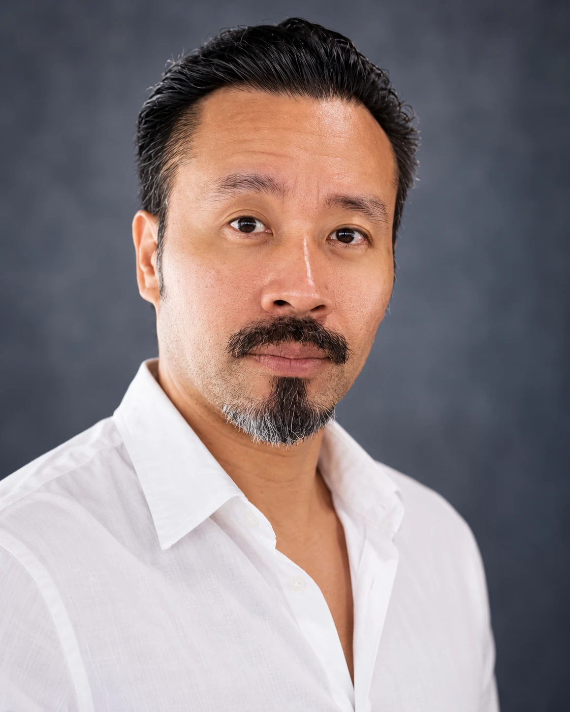 Marvin Fernandez main headshot in a white shirt