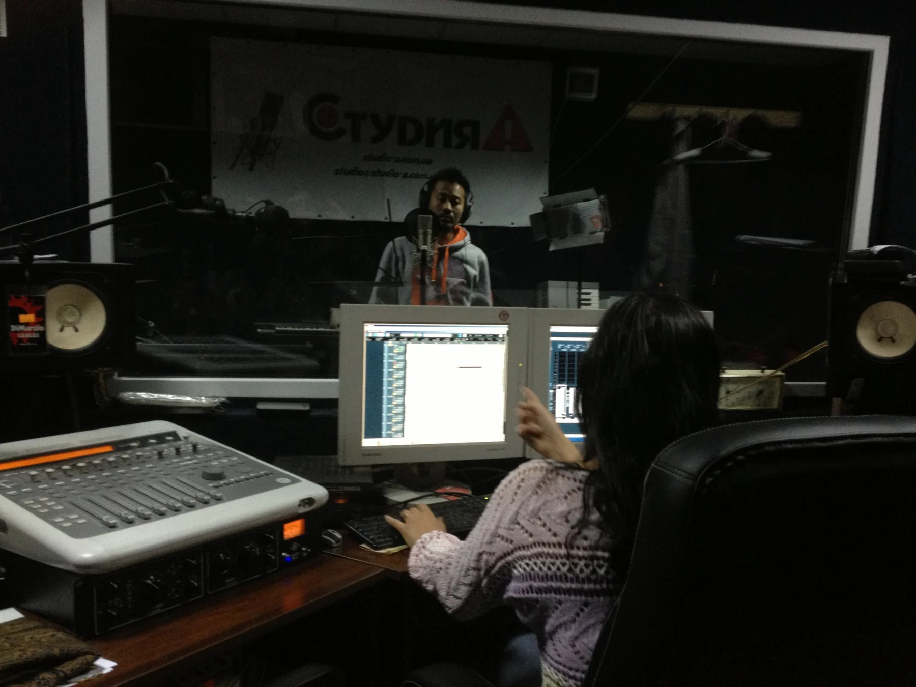 Marvin recording behind the studio glass, with the engineer at the desk